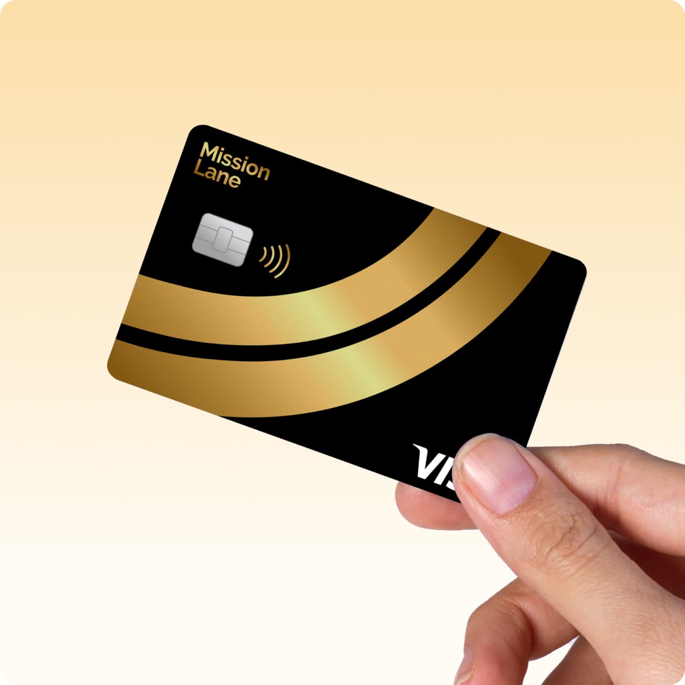 Hand holding Mission Lane Gold Line Visa credit card