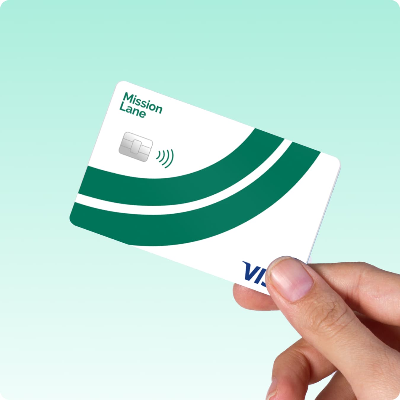 Hand holding Mission Lane Green Line Visa credit card