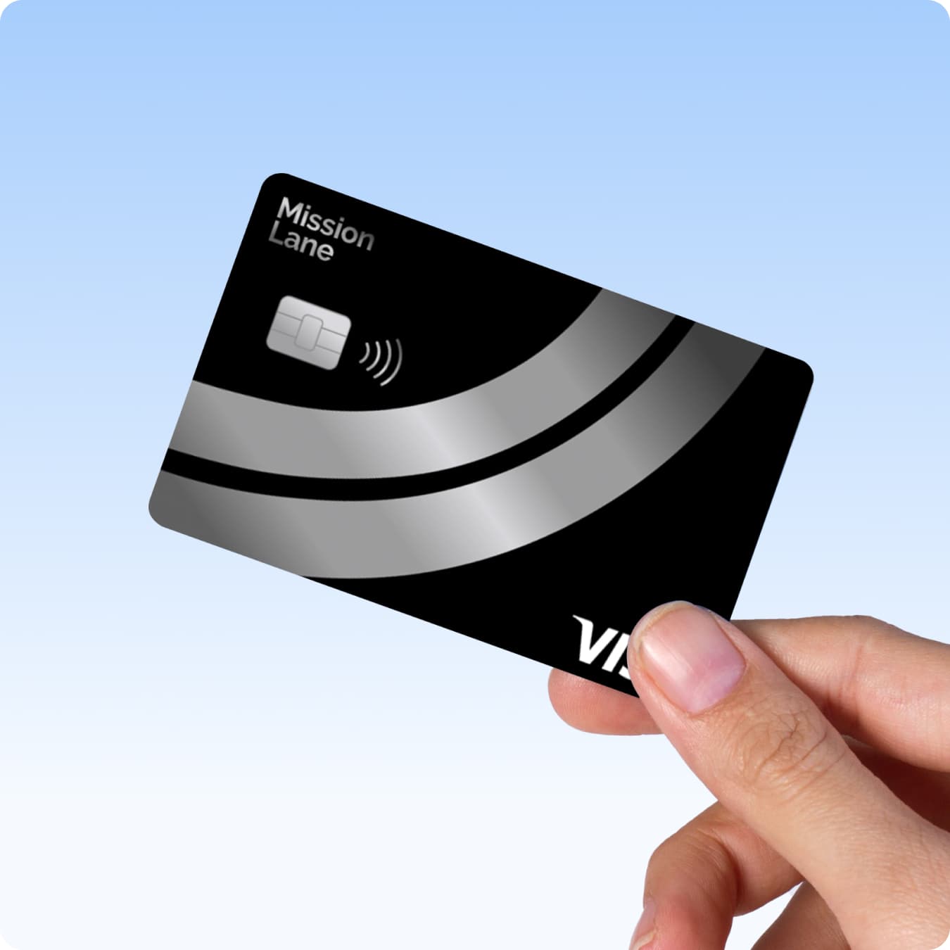 Hand holding Mission Lane Silver Line Visa credit card